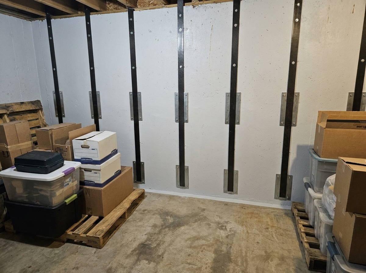 Same wall pulled straight and reinforced with carbon fiber, after repair